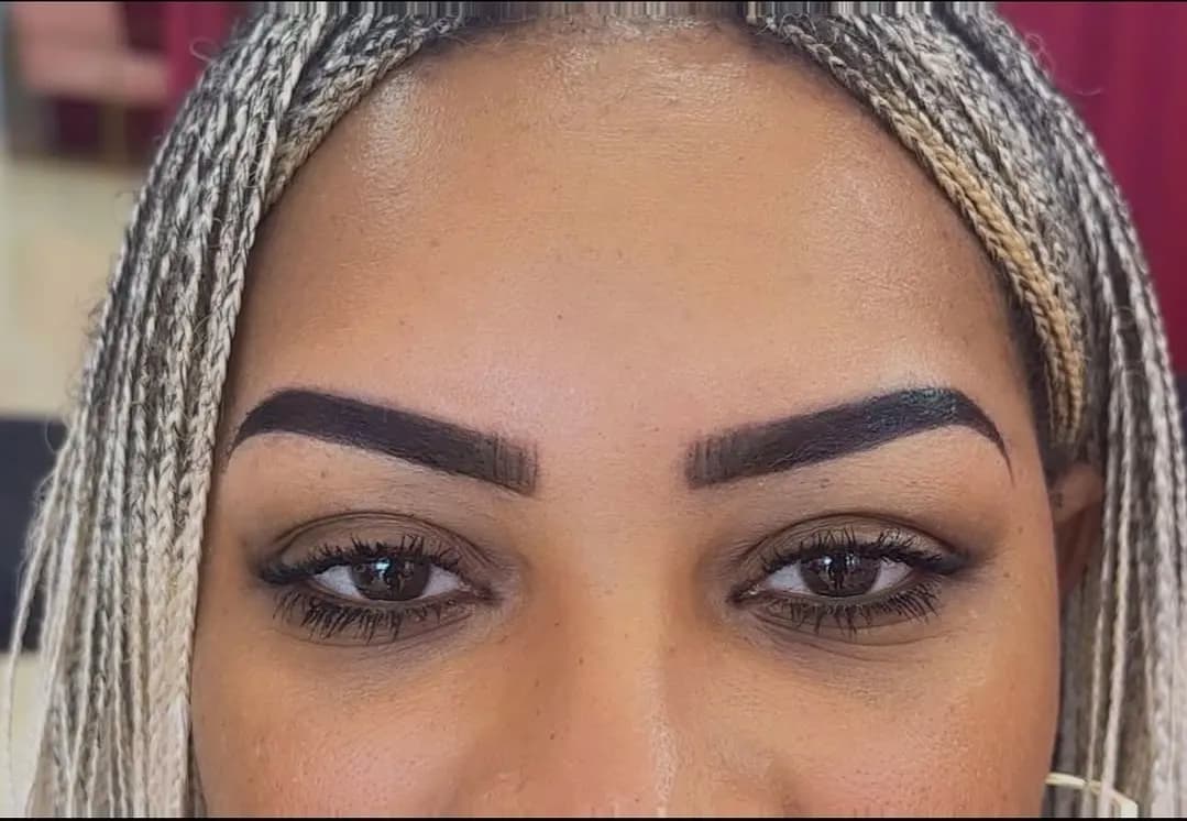 Detailed close-up of freshly completed ombré brow shaping